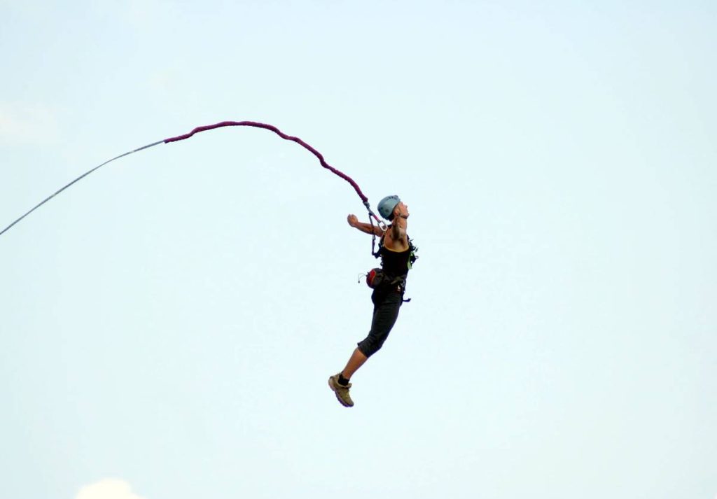 A man jumps from a cliff into the abyss.